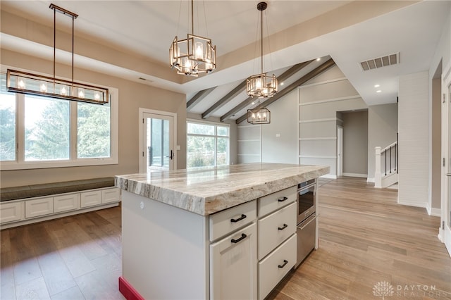 1461 Abbey Park Pl, Beavercreek Twp, OH 45385 - kitchen with a chandelier, light wood-style flooring, white cabinets, light stone counters, and a center island