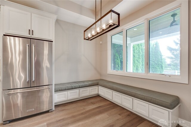 1461 Abbey Park Pl, Beavercreek Twp, OH 45385 - kitchen featuring high end fridge, white cabinets, light wood-style flooring, and a chandelier