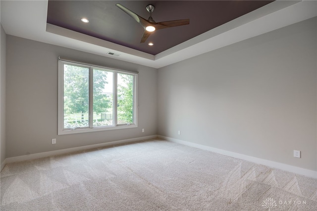 1461 Abbey Park Pl, Beavercreek Twp, OH 45385 - spare room with light colored carpet, ceiling fan, a tray ceiling, and recessed lighting
