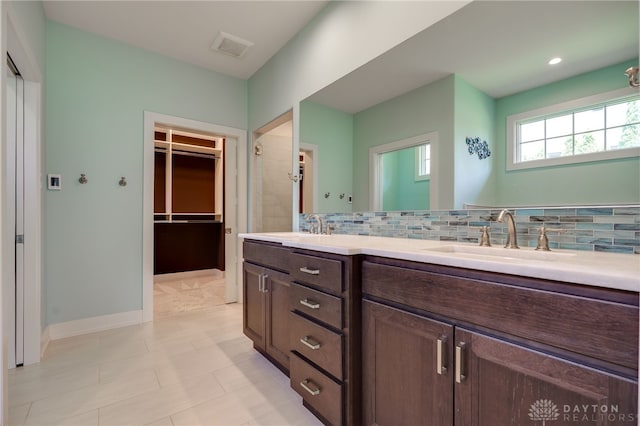 1461 Abbey Park Pl, Beavercreek Twp, OH 45385 - bathroom featuring double vanity, backsplash, a spacious closet, and a shower