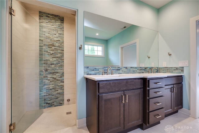 1461 Abbey Park Pl, Beavercreek Twp, OH 45385 - bathroom with a stall shower, double vanity, tile patterned flooring, tasteful backsplash, and recessed lighting