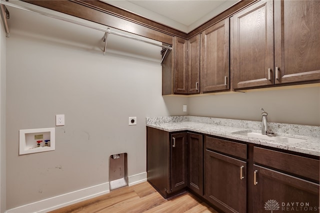 1461 Abbey Park Pl, Beavercreek Twp, OH 45385 - washroom with washer hookup, electric dryer hookup, cabinet space, and light wood-style floors