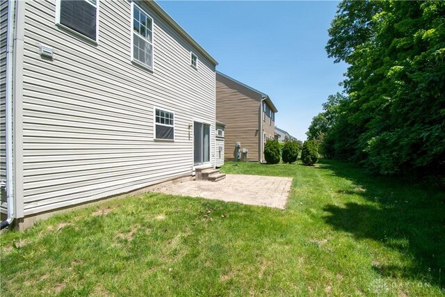 3583 King Edward Way, Beavercreek, OH 45431 - rear view of house featuring entry steps, a patio area, and a yard