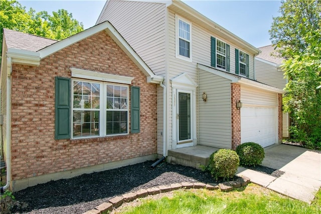 3583 King Edward Way, Beavercreek, OH 45431 - view of front of house with brick siding, driveway, and a garage