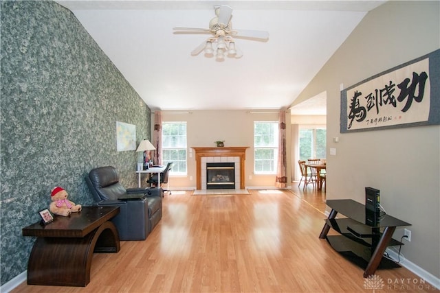 3583 King Edward Way, Beavercreek, OH 45431 - living room with wallpapered walls, healthy amount of natural light, wood finished floors, vaulted ceiling, and an accent wall