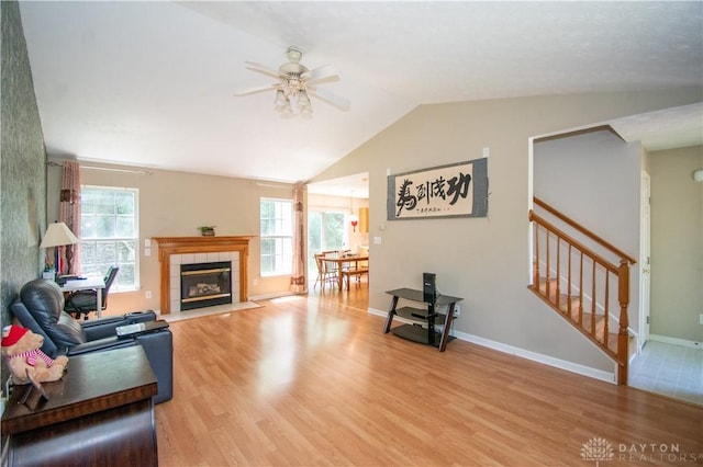 3583 King Edward Way, Beavercreek, OH 45431 - living room featuring light wood-style floors, ceiling fan, lofted ceiling, healthy amount of natural light, and stairway