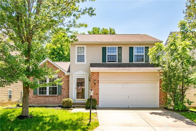 3583 King Edward Way, Beavercreek, OH 45431 - traditional-style house with concrete driveway, brick siding, an attached garage, and a front lawn