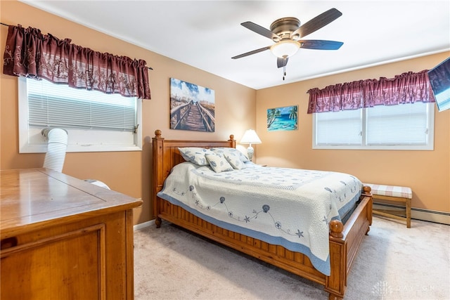 5136 Oleva Dr, Sugarcreek Twp, OH 45440 - bedroom featuring light colored carpet, ceiling fan, and a baseboard radiator