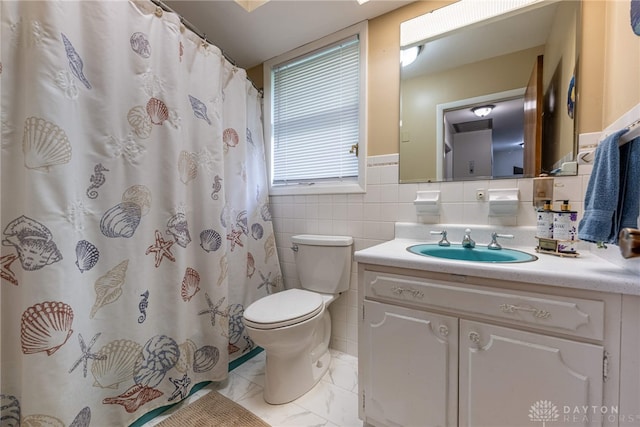 5136 Oleva Dr, Sugarcreek Twp, OH 45440 - bathroom featuring vanity, tile walls, marble look tiles, a shower with shower curtain, and a wainscoted wall