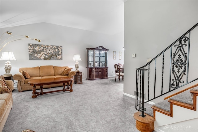 5136 Oleva Dr, Sugarcreek Twp, OH 45440 - carpeted living area with lofted ceiling and stairs