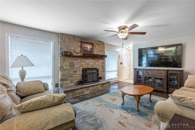 5136 Oleva Dr, Sugarcreek Twp, OH 45440 - living area featuring ceiling fan, a wood stove, and wood finished floors