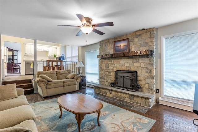 5136 Oleva Dr, Sugarcreek Twp, OH 45440 - living room featuring ceiling fan, wood finished floors, and a fireplace
