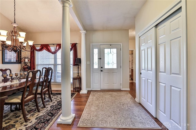 595 Heatherwoode Cir, Springboro, OH 45066 - foyer featuring healthy amount of natural light, a chandelier, and dark wood finished floors
