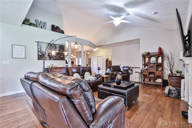 595 Heatherwoode Cir, Springboro, OH 45066 - living area featuring decorative columns, ceiling fan, wood finished floors, and lofted ceiling