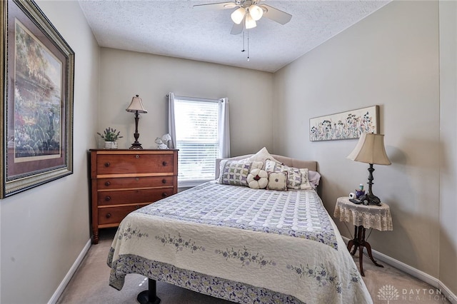 595 Heatherwoode Cir, Springboro, OH 45066 - carpeted bedroom with a textured ceiling and a ceiling fan