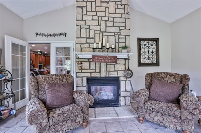 595 Heatherwoode Cir, Springboro, OH 45066 - living area with lofted ceiling, tile patterned floors, and a fireplace