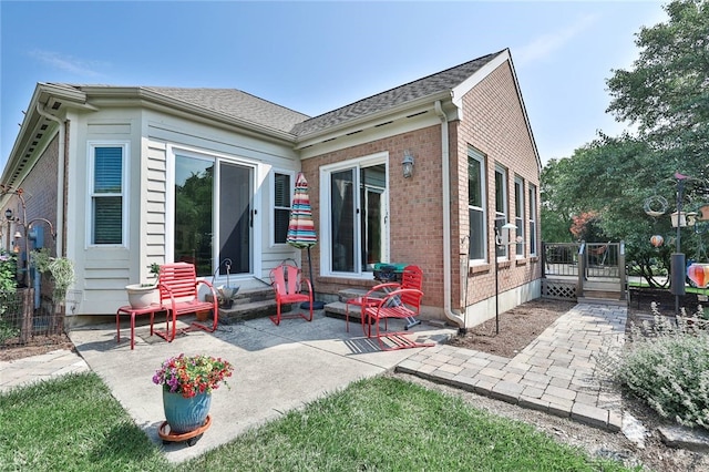 595 Heatherwoode Cir, Springboro, OH 45066 - back of house with a patio and brick siding