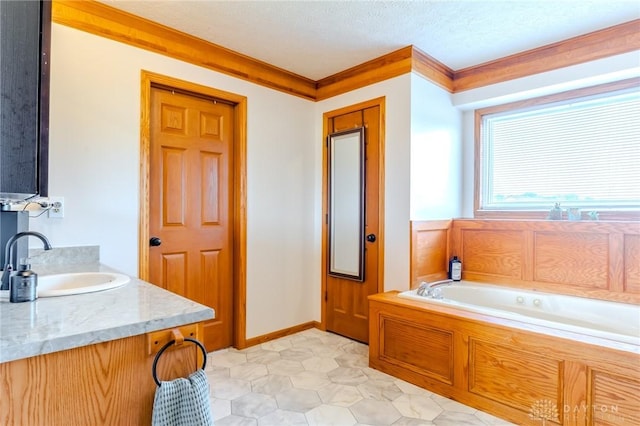 1061 Mcpherson Rd, Xenia, OH 45385 - full bathroom featuring a jetted tub, ornamental molding, and vanity