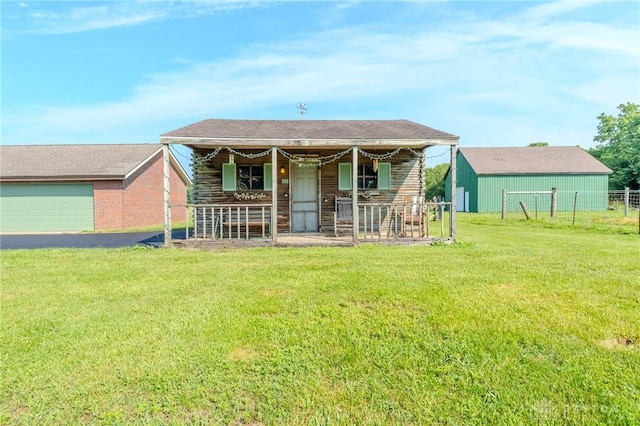 1061 Mcpherson Rd, Xenia, OH 45385 - rear view of house with an outdoor structure, a yard, and a garage