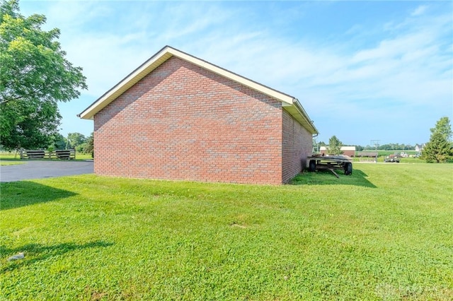 1061 Mcpherson Rd, Xenia, OH 45385 - view of property exterior with brick siding and a yard