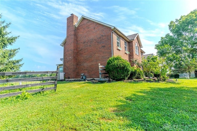 1061 Mcpherson Rd, Xenia, OH 45385 - view of property exterior featuring brick siding and a chimney