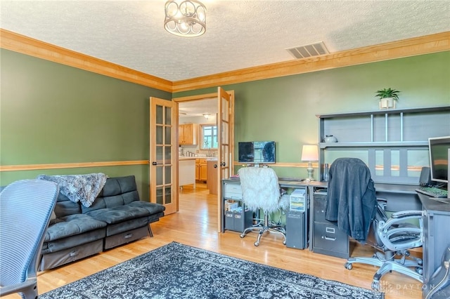 1061 Mcpherson Rd, Xenia, OH 45385 - office with a textured ceiling, ornamental molding, wood finished floors, and french doors