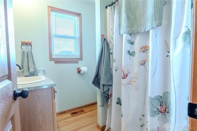 1061 Mcpherson Rd, Xenia, OH 45385 - bathroom featuring vanity, wood finished floors, and curtained shower