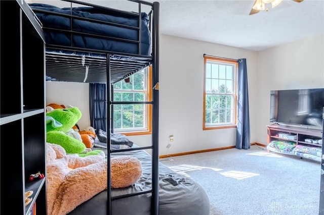 1061 Mcpherson Rd, Xenia, OH 45385 - carpeted bedroom featuring multiple windows and ceiling fan