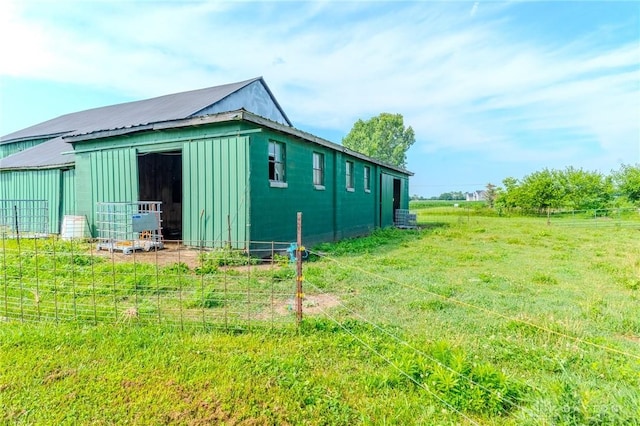 1061 Mcpherson Rd, Xenia, OH 45385 - view of home's exterior featuring board and batten siding, an outbuilding, and a metal roof