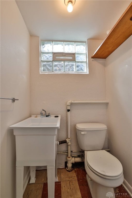 1095 Susan Dr, Hamilton, OH 45013 - half bathroom with healthy amount of natural light and wood finished floors