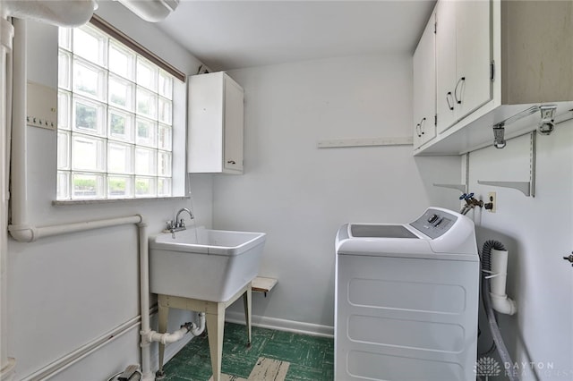 1095 Susan Dr, Hamilton, OH 45013 - laundry area with cabinet space, plenty of natural light, and washer and dryer