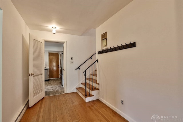 1095 Susan Dr, Hamilton, OH 45013 - entryway featuring hardwood / wood-style floors, a baseboard heating unit, and stairway