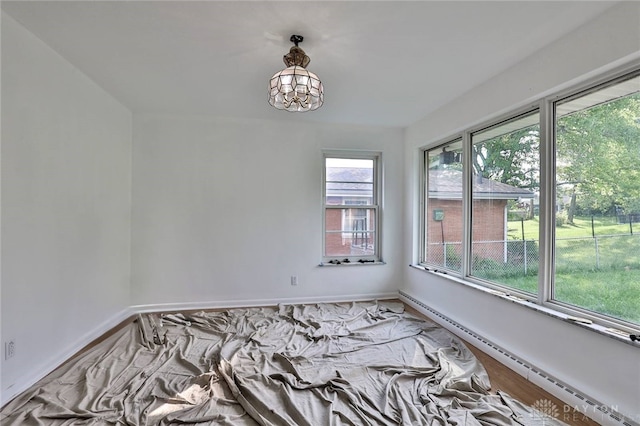 1095 Susan Dr, Hamilton, OH 45013 - unfurnished room with a baseboard radiator and a chandelier