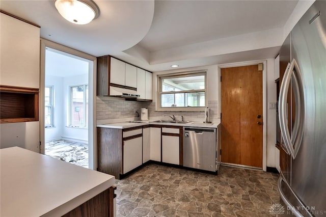 1095 Susan Dr, Hamilton, OH 45013 - kitchen featuring stainless steel appliances, light countertops, dark stone finish floors, backsplash, and white cabinets