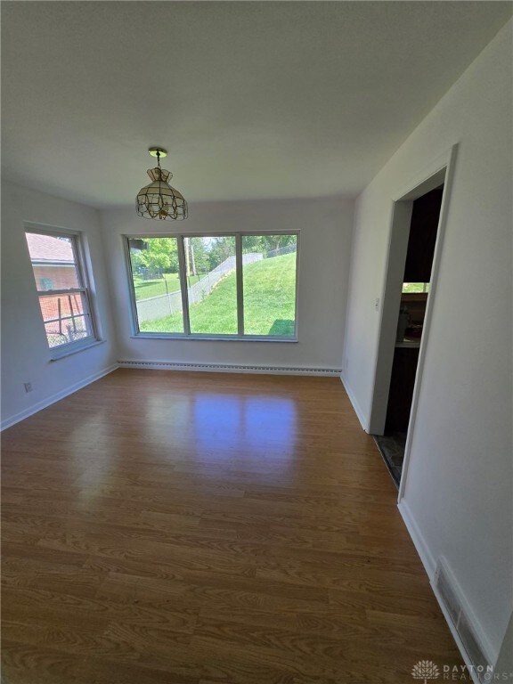 1095 Susan Dr, Hamilton, OH 45013 - empty room featuring dark wood-style flooring