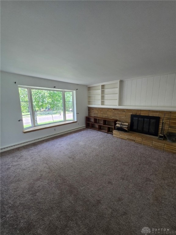 1095 Susan Dr, Hamilton, OH 45013 - unfurnished living room with carpet, a baseboard heating unit, and a fireplace