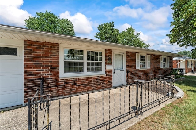 1021 Nutmeg Sq, Troy, OH 45373 - ranch-style home with brick siding and a garage