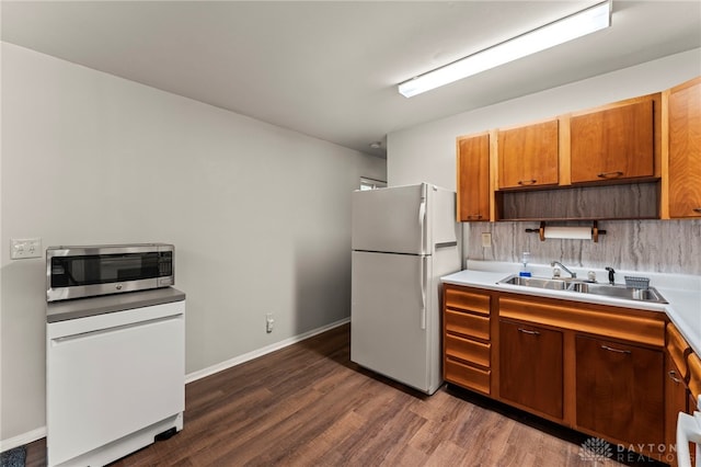 1021 Nutmeg Sq, Troy, OH 45373 - kitchen with freestanding refrigerator, stainless steel microwave, dark wood-style floors, open shelves, and light countertops