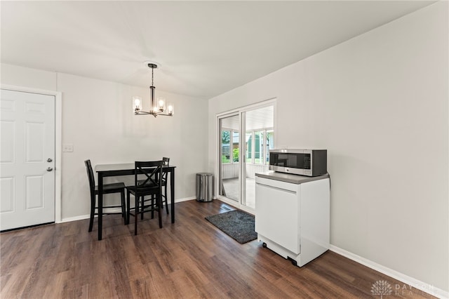 1021 Nutmeg Sq, Troy, OH 45373 - dining space featuring a chandelier, dark wood finished floors, and radiator heating unit