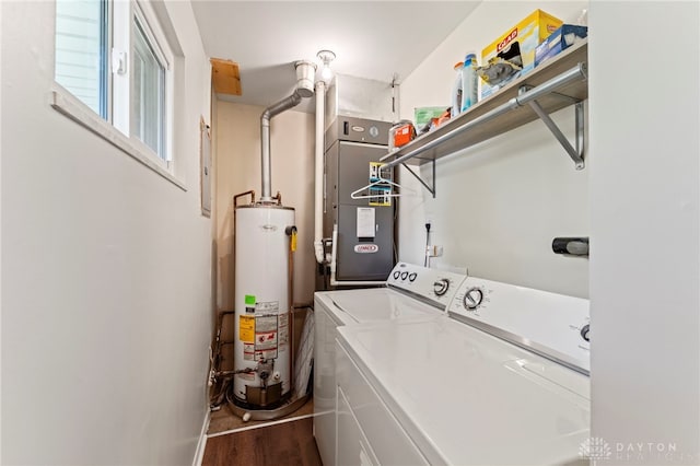 1021 Nutmeg Sq, Troy, OH 45373 - laundry room with water heater, washer and clothes dryer, wood finished floors, and heating unit