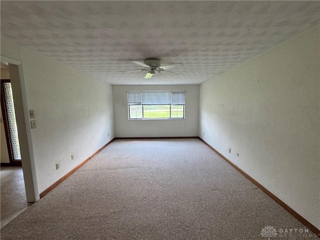 2886 Kemp Rd, Beavercreek, OH 45431 - carpeted spare room with a textured wall, a textured ceiling, and a ceiling fan