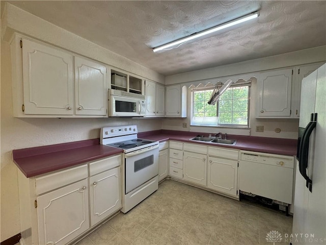2886 Kemp Rd, Beavercreek, OH 45431 - kitchen featuring white appliances and dark countertops