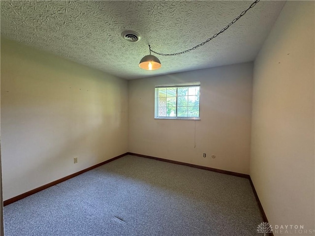 2886 Kemp Rd, Beavercreek, OH 45431 - carpeted spare room with baseboards and a textured ceiling