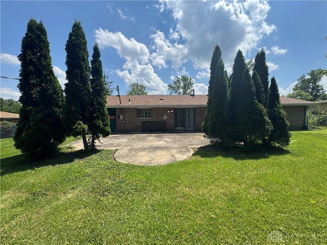 2886 Kemp Rd, Beavercreek, OH 45431 - back of property featuring a patio area, a yard, and brick siding