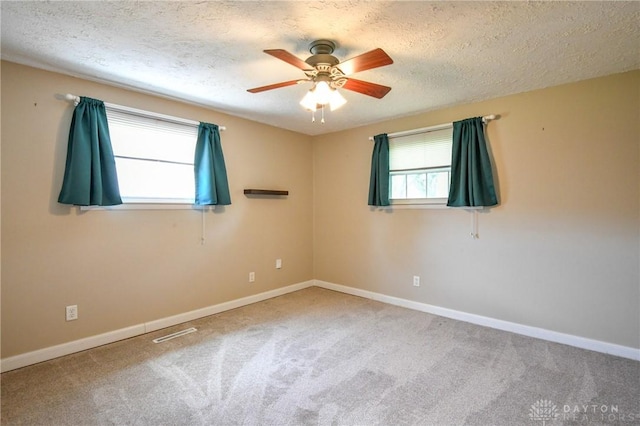 174 Tuxworth Rd, Dayton, OH 45458 - empty room with a textured ceiling, carpet floors, and a ceiling fan