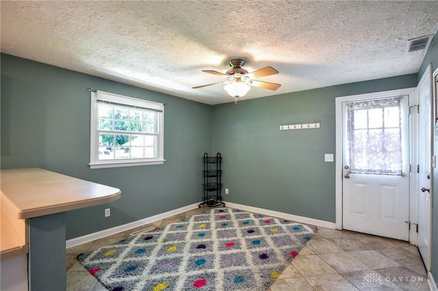 174 Tuxworth Rd, Dayton, OH 45458 - tiled foyer featuring a ceiling fan and a textured ceiling