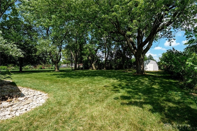 222 Kenderton Trl, Beavercreek, OH 45430 - view of green lawn with a shed