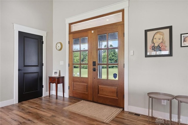 9782 E US Highway 22 And 3, Clarksville, OH 45113 - foyer featuring baseboards and wood finished floors