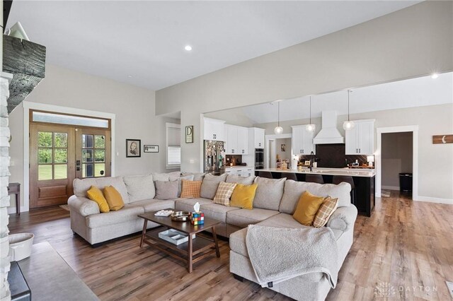 9782 E US Highway 22 And 3, Clarksville, OH 45113 - living area with light wood-type flooring, french doors, and high vaulted ceiling