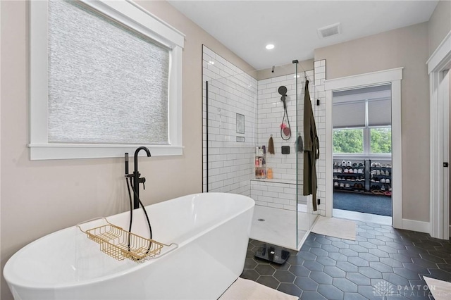 9782 E US Highway 22 And 3, Clarksville, OH 45113 - bathroom featuring a stall shower, a freestanding bath, recessed lighting, and tile patterned floors